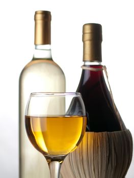 Bottles of white and red wine with wineglass