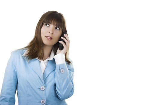 A happy businesswoman holding a phone and talking

