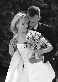 The groom and the bride in park