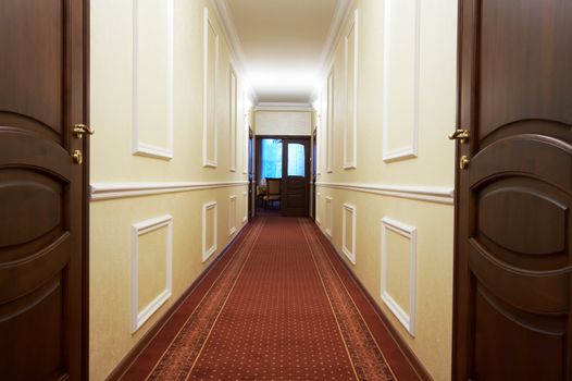 Long corridor with a window in modern hotel