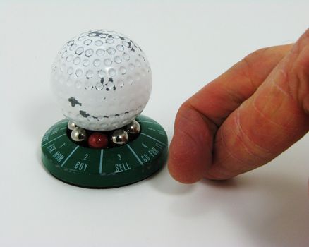 Spin the golf ball to make an executive decision. Then cross your fingers.