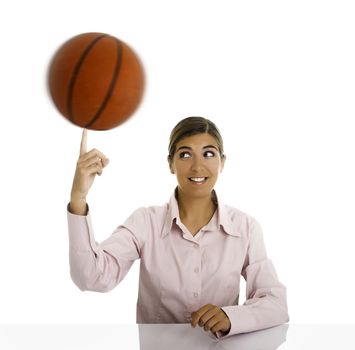 Woman with a basketball rolling on is hand