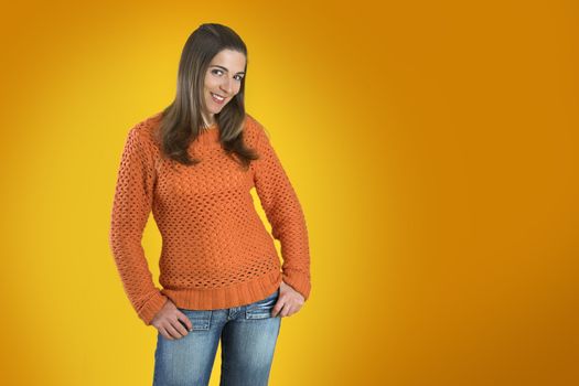 Beautiful woman with a frendly face on a orange background