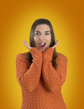 Beautiful woman with a frendly face on a orange background