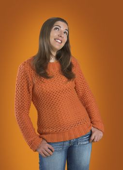 Beautiful woman with a frendly face on a orange background