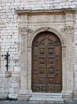 An ancient church door in Assisi, Italy.