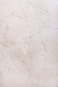 Brown plaster with a deep relief on a wall