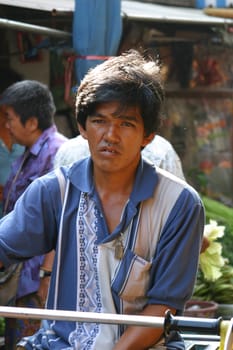 Man at a market in Bangkok, thailand