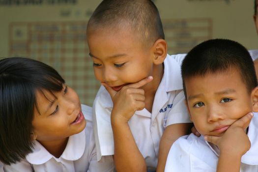 Adorable schoolchildren having fun with the photographer