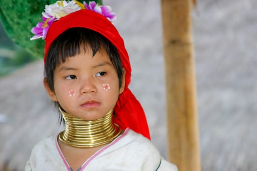 Child of the black karen tribe with the well known rings around her neck giving the tribe their original name of "longnecks'