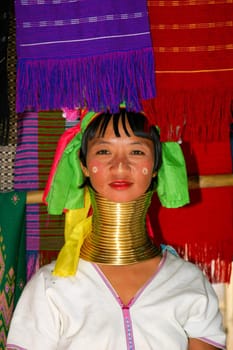 Woman of the black Karen tribe with the traditional rings around her neck