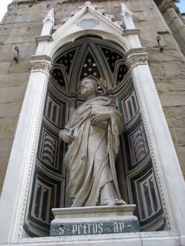 Statue of St Peter in a niche in the Church of Orsanmichele in Florence, Italy.