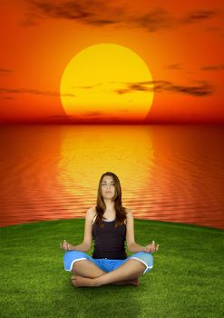 Beautiful woman making yoga at the sunset  (background digitally created) 