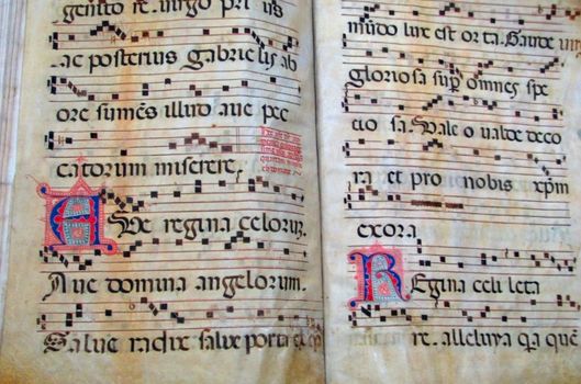 An antique music book from the renaissance era in Italy.