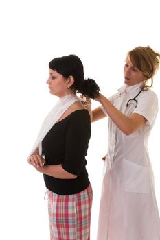 Woman getting a sling measured on by a nurse
