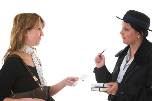 Woman accepting a parkingticket from a female police officer while pulling a face