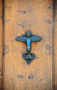The Metal Door Handle In The Form Of The Angel