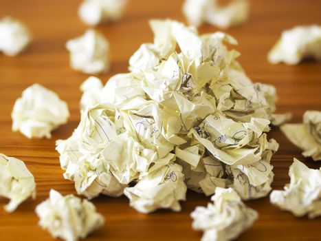 close up of heap of waste paper on desk