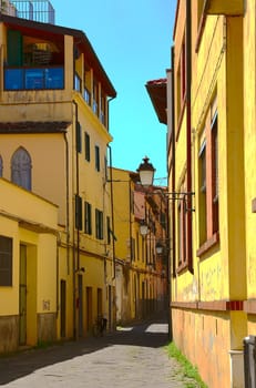 Narrow Alley With Old Buildings In Italian City of Pisa