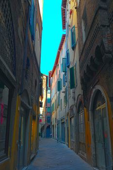 Narrow Alley With Old Buildings In Italian City of Lucca