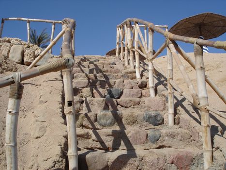 Stairway to the red sea beach