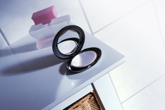 black makeup box on a white table in the bathroom