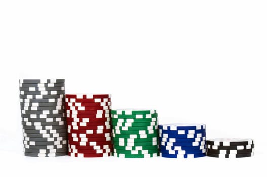 Piled poker chips in row isolated on white background