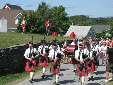 colorful group of bagpipers editorial use only shot at harbor grace newfoundland July 19th 2009