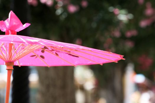 a pink hand made umbrella   