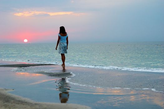 A woman early in the morning on the sea