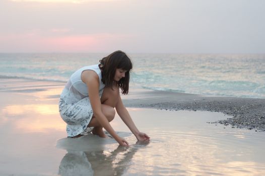 A woman early in the morning on the sea