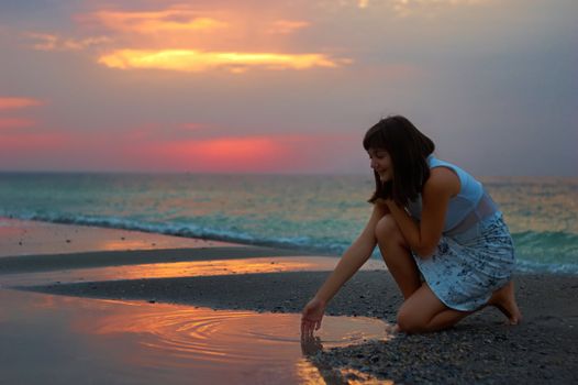 A woman early in the morning on the sea