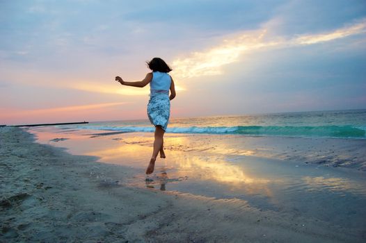 A woman early in the morning on the sea