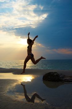 A woman early in the morning on the sea