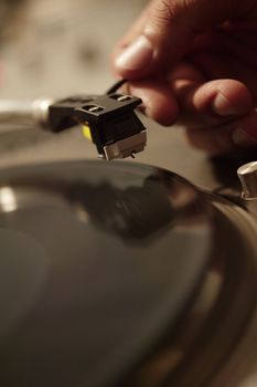 Person About to Play Record on Record Player