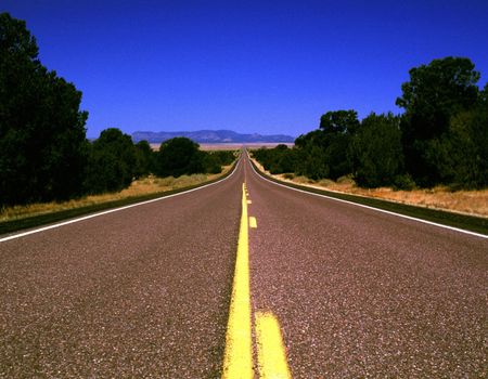 Open Road through Southwestern United States under Blue Skies