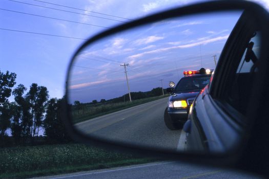 Police Car In Side View Mirror