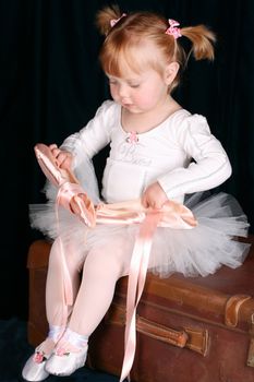 Little ballet toddler wearing a white tutu
