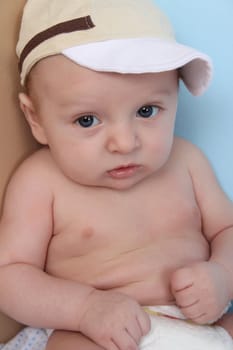 Ten week old baby boy wearing a hat