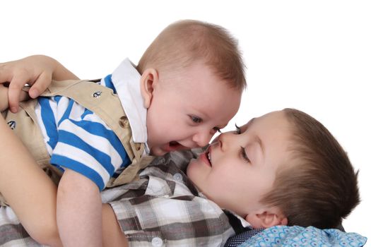 Brothers playing and laughing on the floor