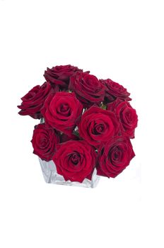 Bunch of red rose flowers in a small vase (top view)