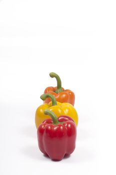 red, yellow and orange capsicums (aligned view)