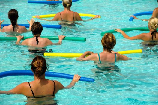 Wemen doing water aerobic in pool