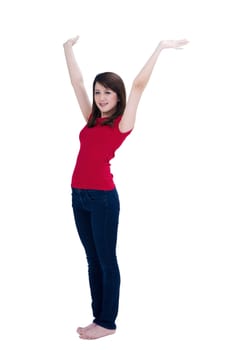 Portrait of a happy young woman cheering with her arms raised, over white background.