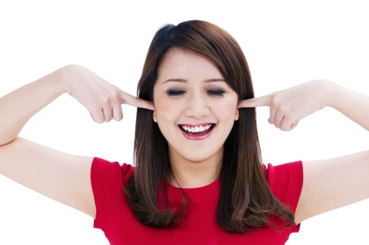 Portrait of a beautiful young woman with fingers in her ears, isolated on white background.