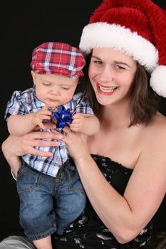 Beautiful christmas mother and son on a black background