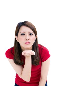 Portrait of a beautiful young woman blowing a kiss, isolated white background.