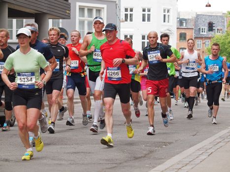 COPENHAGEN - MAY 21: More than 12,000 runners from 40 countries participate in the yearly Copenhagen Marathon. It covers a 42- kilometre route mostly within the city centre in Copenhagen, Denmark.