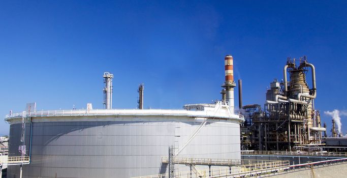 Oil refinery in Italy Milazzo Sicily with tall smokestacks