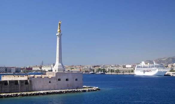 Sicily arrival with the tall statue at the front of the port